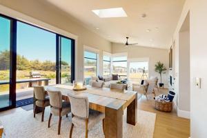 a dining room with a large table and chairs at Cabañita Del Mar in Sea Ranch