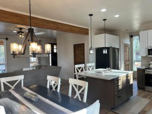 a kitchen and living room with a table and chairs at The Farmhouse in Darby