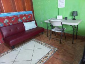 a living room with a couch and a table at Casa MONTOCO 114 in Managua