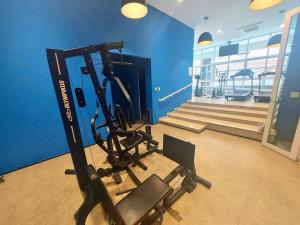 a gym with a exercise bike in a room at Book Santos Mar, Sol e Conforto no Unique 710 e 810 in Santos