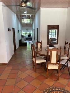 a dining room with a table and chairs at Cabaña AWA in Puerto Salgar
