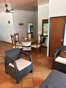 a dining room with a table and chairs at Cabaña AWA in Puerto Salgar