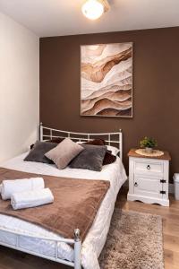 a bedroom with a bed and a painting on the wall at Hotel Style Room within Reading in Reading