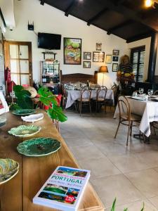 a restaurant with tables and chairs in a room at Micro Cabana Rotativa in Bragança
