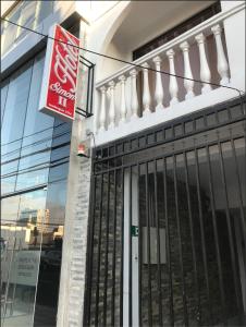 a coca cola sign on the side of a building at Hotel Simon II in Antofagasta