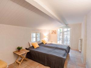 a bedroom with a large bed in a room at Le Mas dormant in Fayence