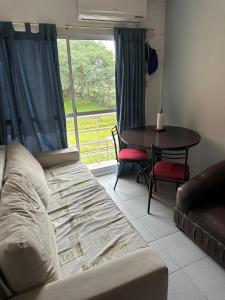 a living room with a couch and a table at Mica in Salta