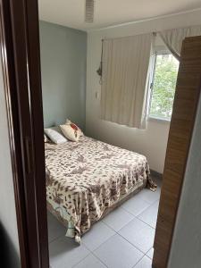 a bedroom with a bed and a window at Mica in Salta