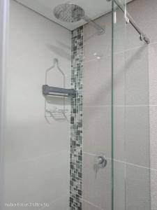 a bathroom with a shower with a glass door at Room cerca al aeropuerto #4 in Bogotá