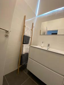 a bathroom with a sink and a mirror at 1955 Guest House in Cebolais de Cima +16 photos