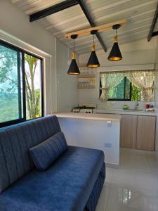 a living room with a couch and a kitchen at Finca La Tranquilidad in San Francisco +21 photos