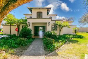 an exterior view of a house with a pathway at 3 bed Cluster home in Sandton in Sandton