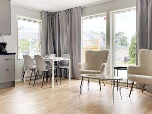 a dining room with a table and chairs at 4 star holiday home in Klintehamn in Klintehamn +24 photos