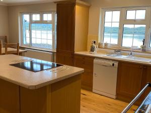 a kitchen with a sink and a counter top at Point Park in Taynuilt