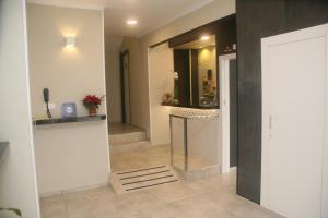 a hallway with a staircase and a mirror in a room at Hostal El Altet in El Alted