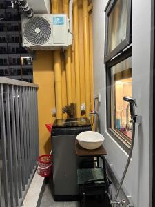 a balcony with a grill and a heater and a window at Trang Due homestay in An Dương +13 photos