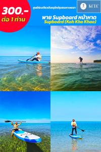 a man on a paddle board in the water at Sunee Seafood Bungalow in Ban Pak Klang