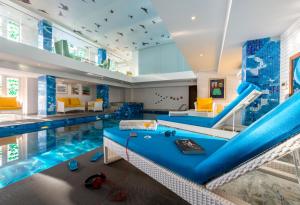 a swimming pool with a slide in a house at Mosaic Original, Mussoorie in Mussoorie