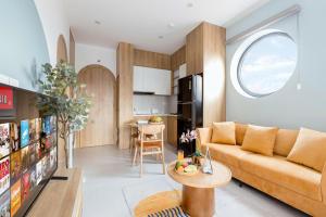 a living room with a couch and a table at Artsy Boutique Studio in Hanoi