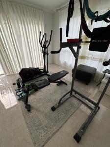 a living room with two treadmills and a gym at Quiet and Cozy Room in Geelong