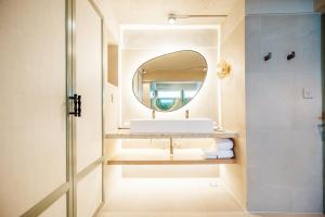 a bathroom with a sink and a mirror at Davinia Hua Hin Resort in Hua Hin +82 photos