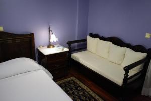 Postelja oz. postelje v sobi nastanitve Ilion Hotel