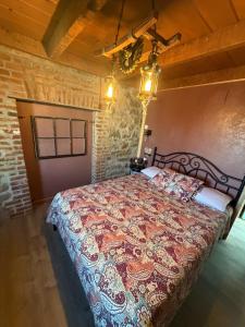 a bedroom with a large bed in a room at Sugarloaf Mountain Motel in Virginia City