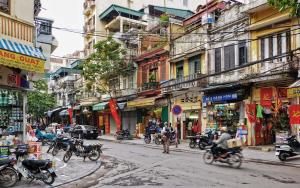 a group of motorcycles parked on a city street at Eco Nest Hotel 6 Đình Ngang in Hanoi