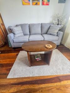a living room with a couch and a coffee table at Sand and Sol Rental in Hopkins