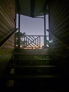 a stairway leading to a window in a building at Sand and Sol Rental in Hopkins