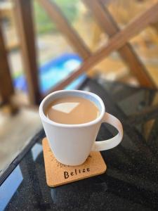 a cup of coffee sitting on top of a table at Sand and Sol Rental in Hopkins