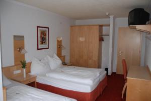 Postel nebo postele na pokoji v ubytování Alpenhotel Regina