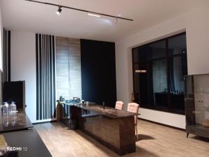 a room with a desk and chairs in a room at Billa Sea breeze in Baku +1 photo