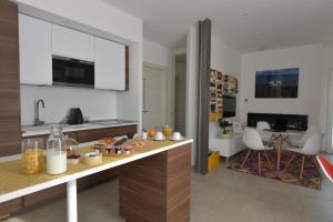 a kitchen with a counter with food on it at Villa Catona Trigoria in Rome