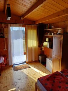 a room with a large sliding glass door in a house at Chalet Glamping in Myza Igaste