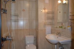 a bathroom with a toilet and a sink at Pomorie Sea&History Residence in Pomorie +34 photos