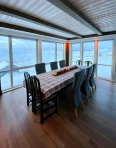a large dining room with a table and chairs at Renovated Mountain Cabin With Mountain Views in Al +24 photos