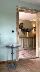an open door to a room with a table at A Historic Gem With Wellness Comfort in Übersee +19 photos