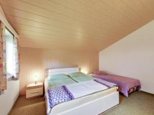 a bedroom with a bed in a small room at Apartment in Afritz near Ski Resorts in Afritz