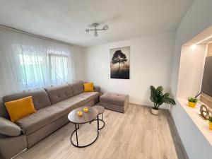 a living room with a couch and a table at Olive Depadance in Mostar