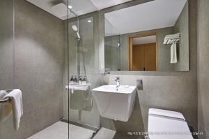 a bathroom with a sink and a toilet and a shower at Hotel Interciti in Daejeon +59 photos