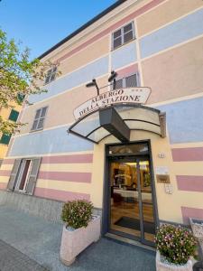 a entrance to a building with a sign on it at ALBERGO DELLA STAZIONE in Cairo Montenotte