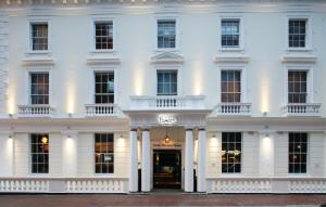 a white building with a front door and columns at Malmaison Reading in Reading