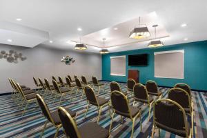 a conference room with chairs and a podium at La Quinta by Wyndham Tampa Central in Tampa +60 photos
