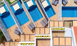 an overhead view of a building with a swimming pool at Aelia Suites in Agios Nikolaos +40 photos