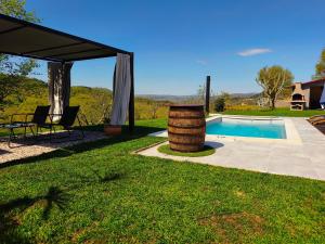 a backyard with a pool and a gazebo at Casa Tone in Grdoselo
