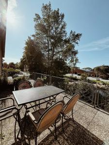a table and chairs sitting on a patio at Appartment, Ferienwohnung auf Fehmarn in Fehmarn +3 photos