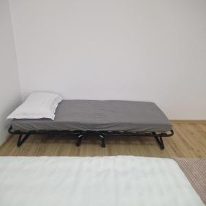 a mattress on a bed frame in a room at Maria Central Studio in Târgu Neamț +3 photos