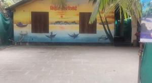 a building with a mural on the side of it at Kihim Beach Resort in Kīhīm