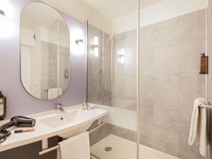 a bathroom with a sink and a shower at ibis Marseille Timone in Marseille
